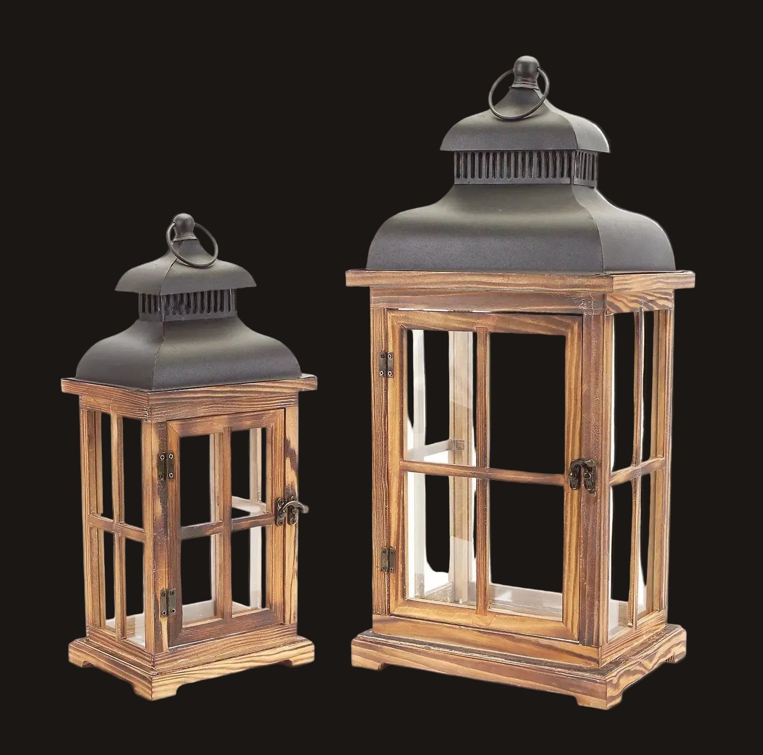 Two wooden lanterns with glass panels on a white background