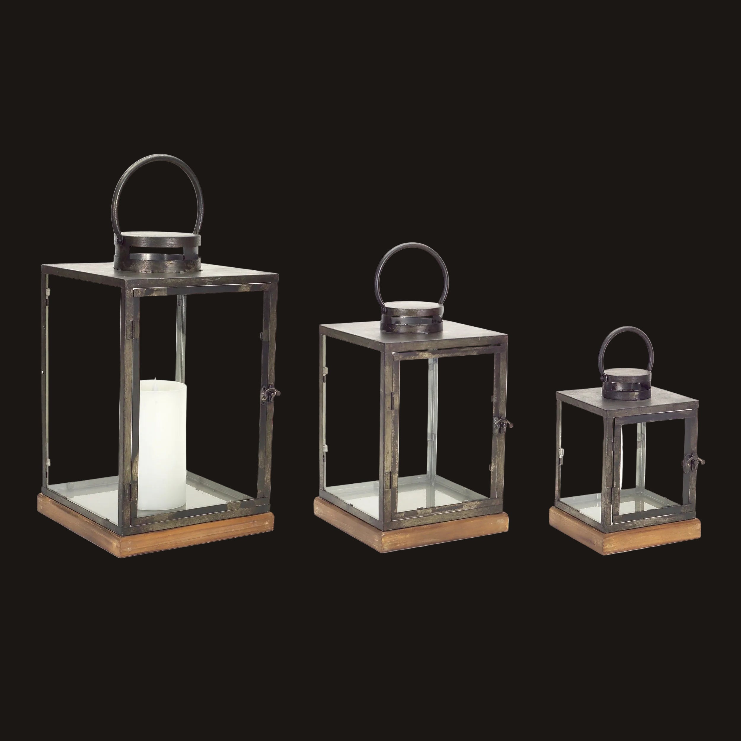 Three metal lanterns of different sizes on a white background