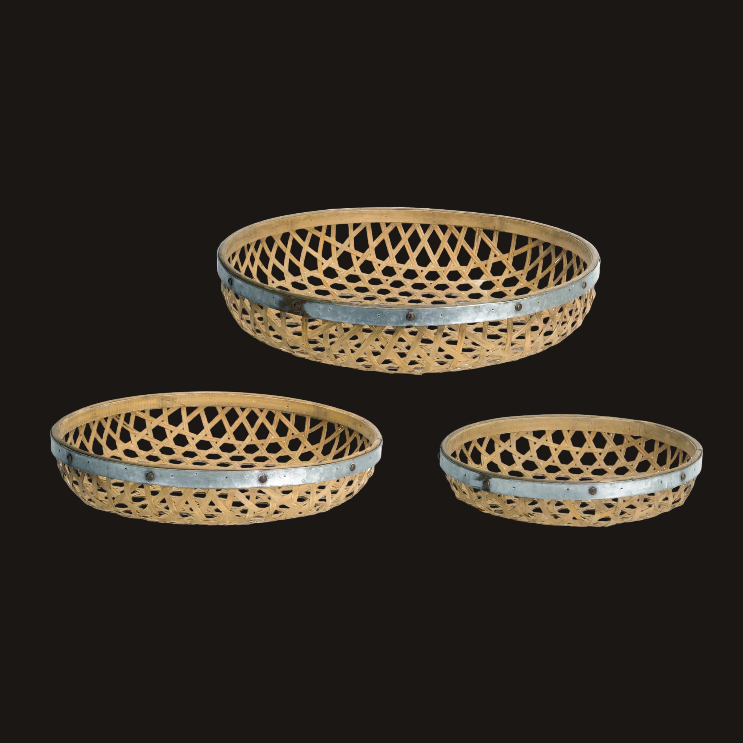 Three woven baskets with metal rims on a white background