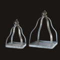 Two metallic lanterns on a white background