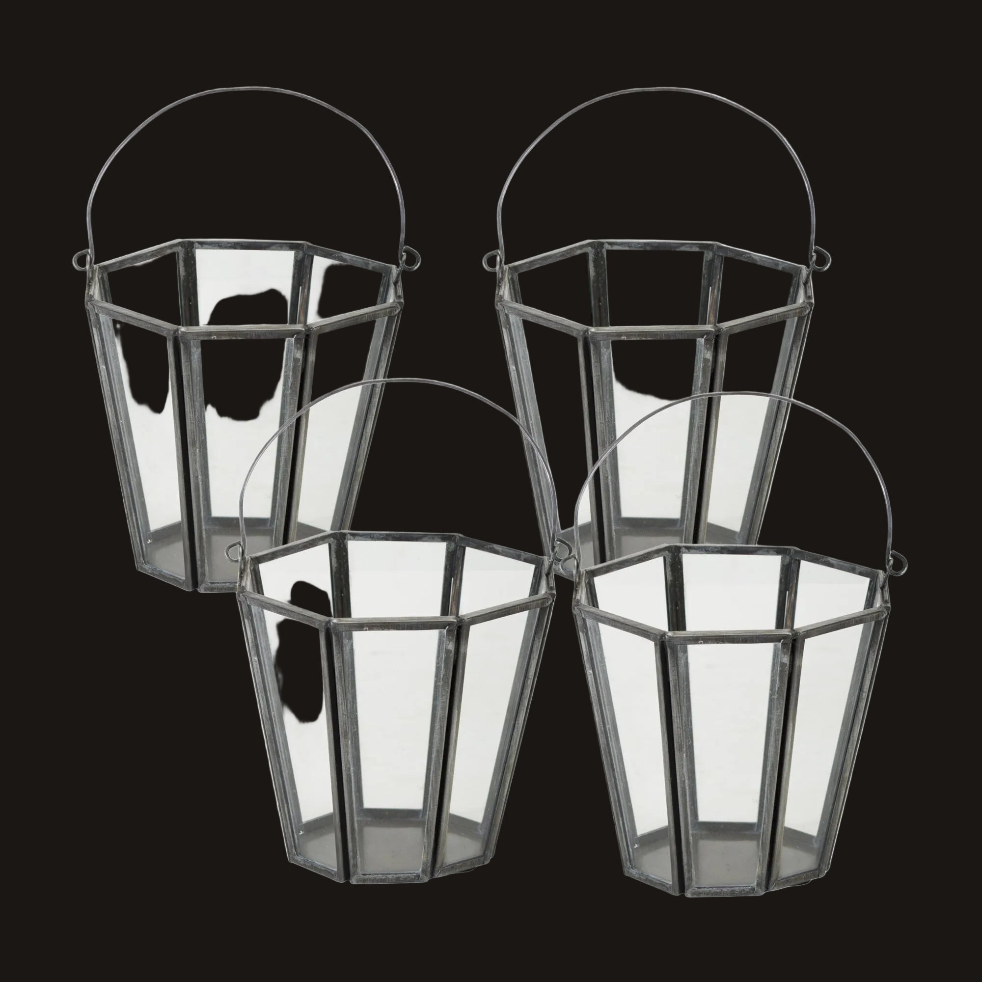 Set of four geometric glass lanterns on a white background
