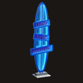 Neon sign shaped like a surfboard with 'Living for the Weekend' text on a white background